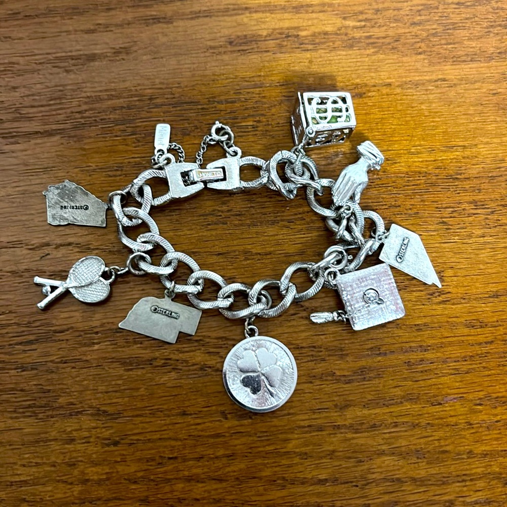 Monet charm bracelet with 3 sterling silver charms